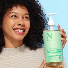Dr. Natural Castile liquid soap shampoo-use close-up indicates versatile cleansing for hair