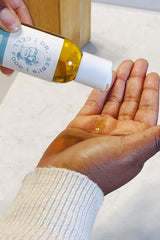 Dr. Sebi's Batana Oil close-up showing natural ingredients shine.