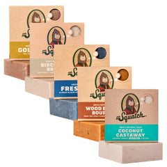 Dr. Squatch Coconut Castaway bar closeup with creamy lather and tropical scent for a refreshing shower.