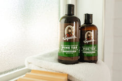 Woodsy-scented Dr. Squatch Pine Tar Shampoo evokes rugged morning routine.