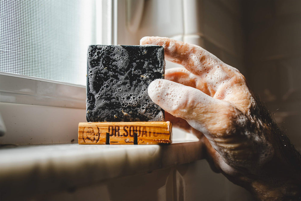 Two-bar Dr. Squatch Pine Tar Soap 2-pack bundle on bathroom shelf.