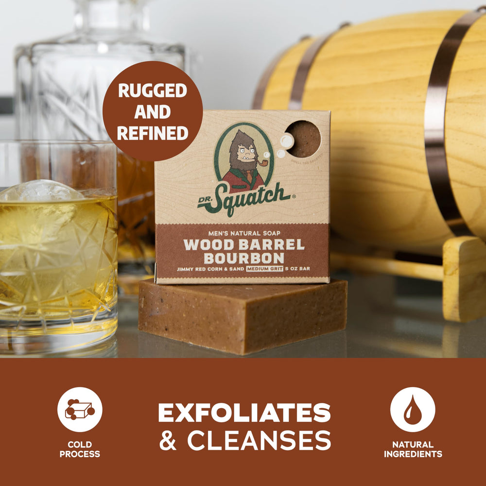 Hand holding Dr. Squatch Wood Barrel Bourbon bar forming creamy lather.