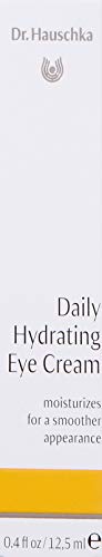 Dr. Hauschka Daily Hydrating Eye Cream application being gently patted under the eye for soothing care.