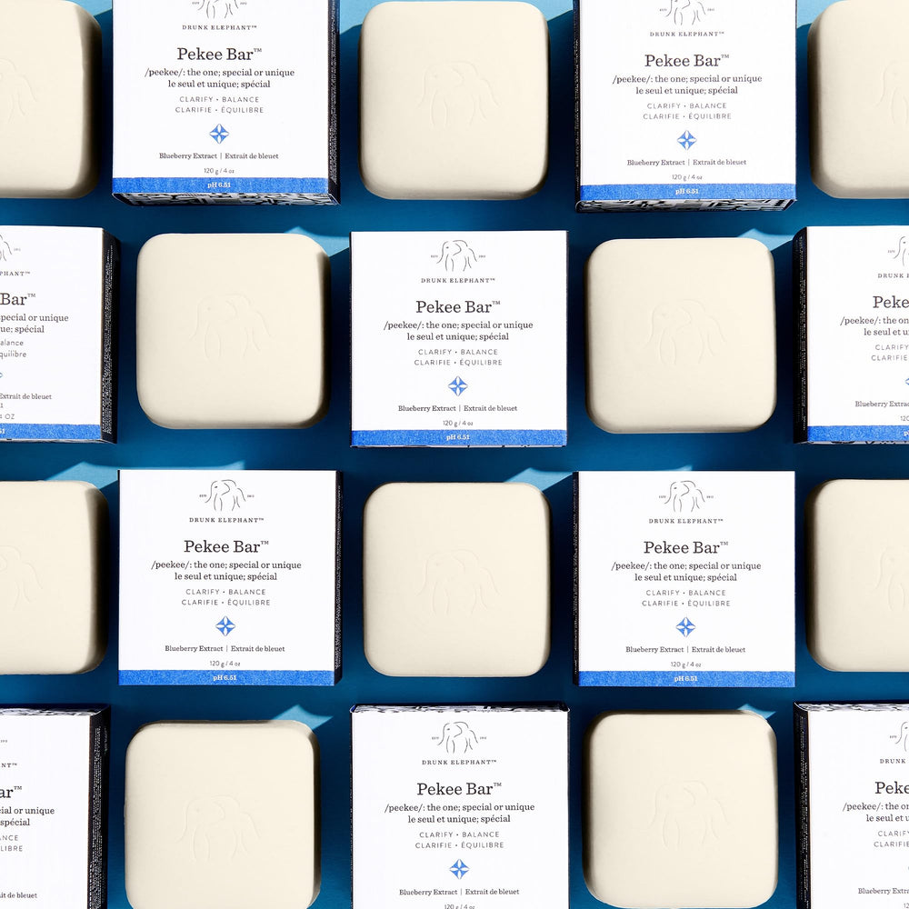 Drunk Elephant Pekee Bar application on face and neck delivers gentle cleansing.