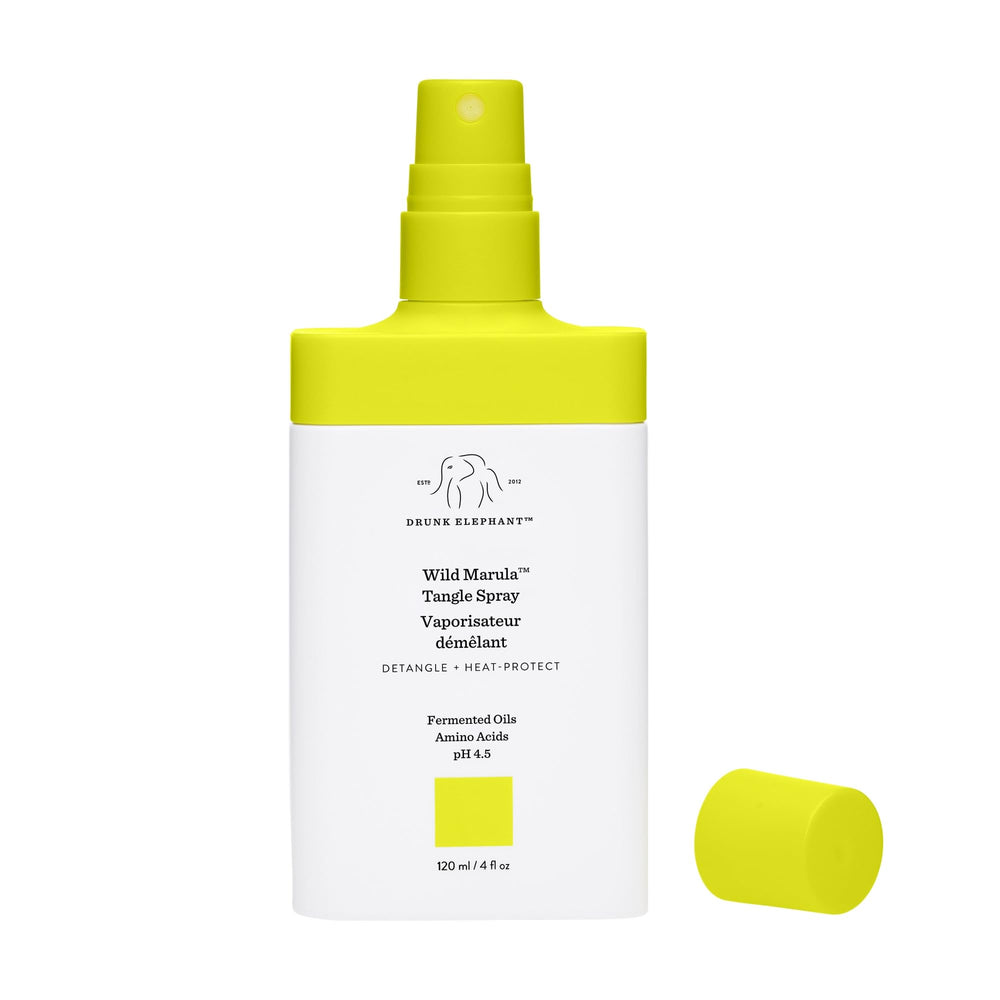 Drunk Elephant Wild Marula Tangle Spray mist distributes evenly on damp hair.