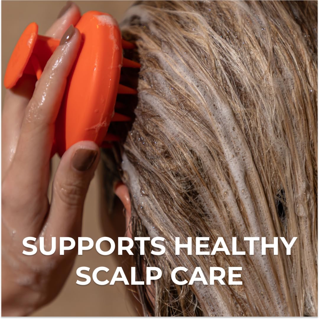 DS Laboratories Revitalizing Scalp Brush during massage promotes even shampoo distribution.