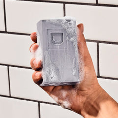 Duke Cannon Big Brick Soap Fresh Cut Pine image evokes invigorating pine aroma for refreshing showers.