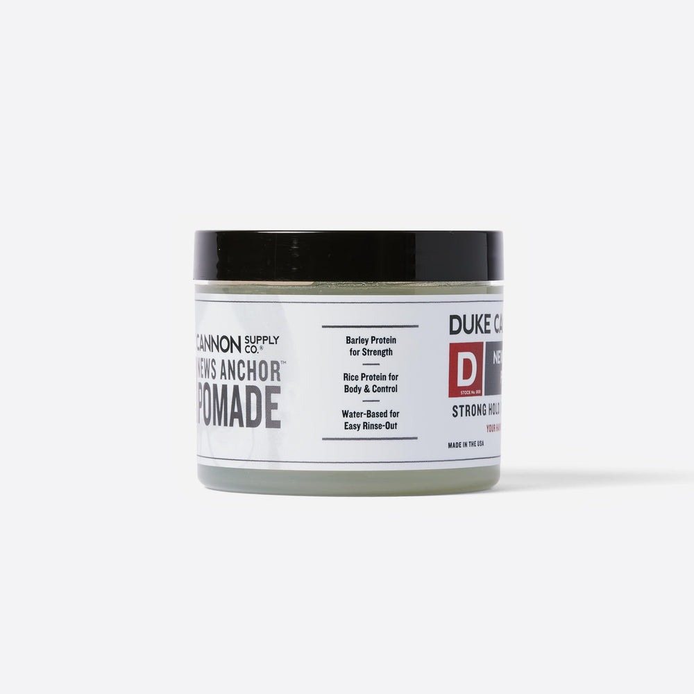 Duke Cannon News Anchor Pomade packaging box showcases premium set for styling routines.