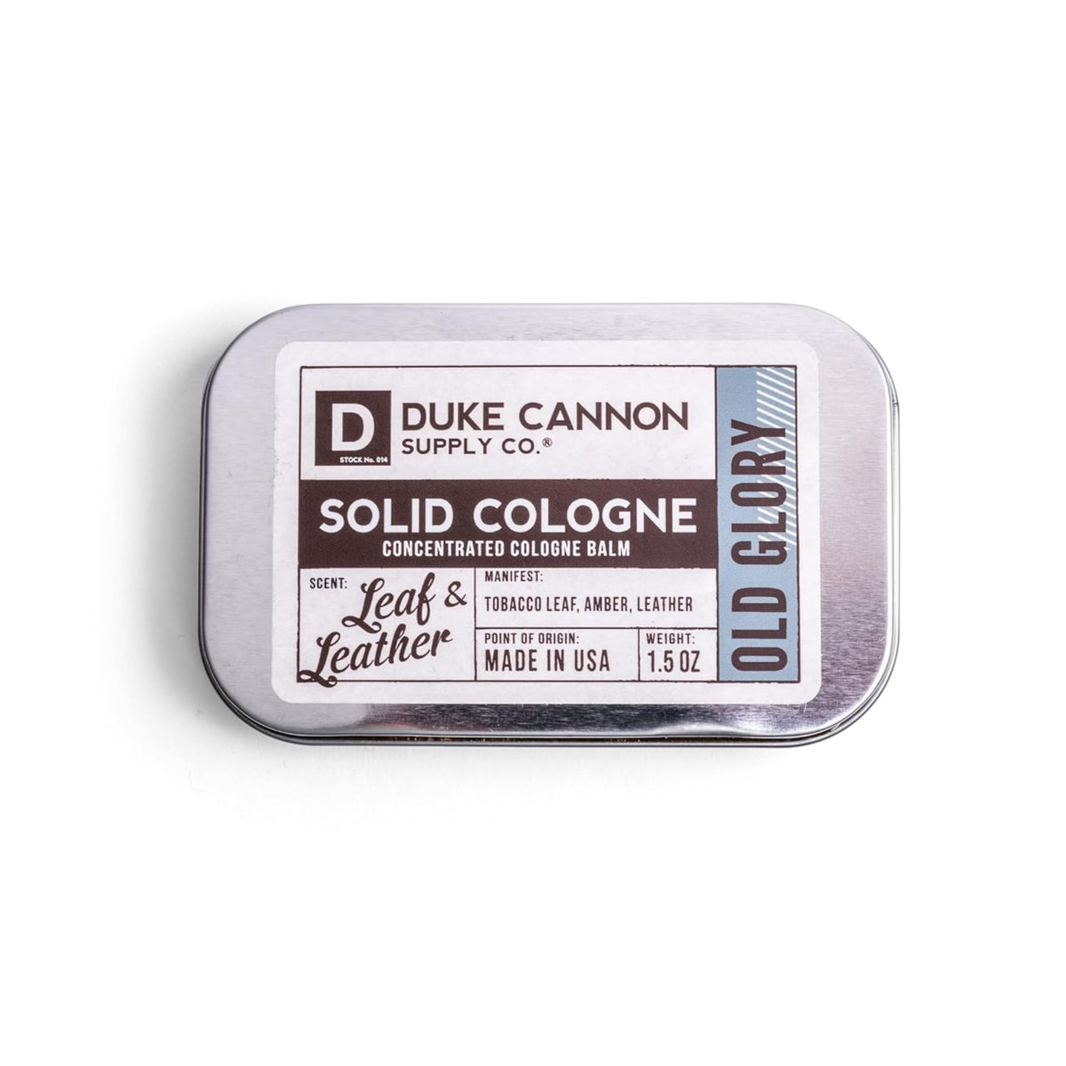 Duke Cannon Old Glory solid cologne tin front view for on-the-go freshness.
