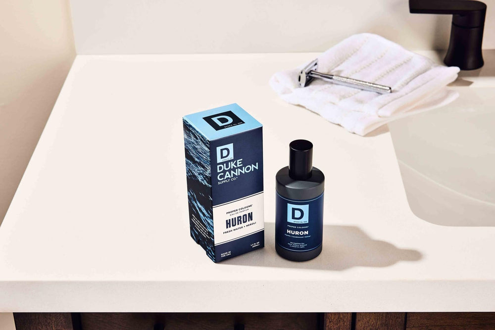 Duke Cannon Proper Cologne Huron apothecary-style glass bottle conveys refined masculine vibe.