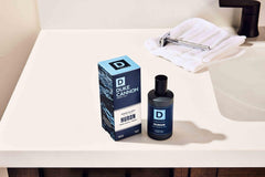 Duke Cannon Proper Cologne Huron apothecary-glass bottle communicates rugged sophistication for bathroom display.