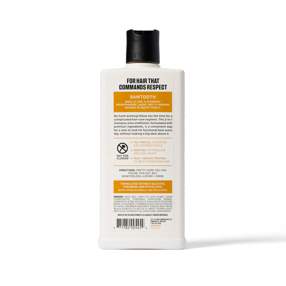 Duke Cannon Sawtooth 2-in-1 Hair Wash bottle close-up highlights refreshing alpine-cedar scent.