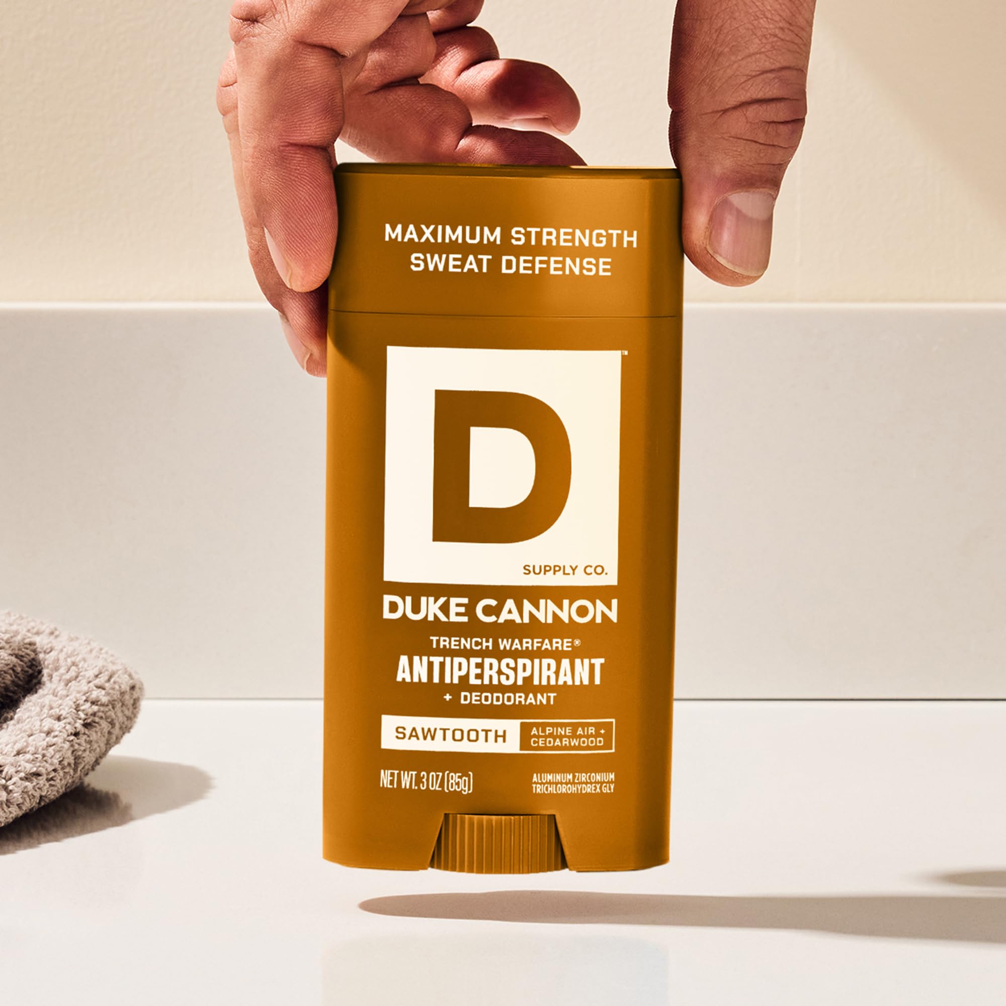Duke Cannon Sawtooth underarm application demonstrates quick daily protection before workouts