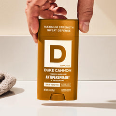 Duke Cannon Sawtooth underarm application demonstrates quick daily protection before workouts