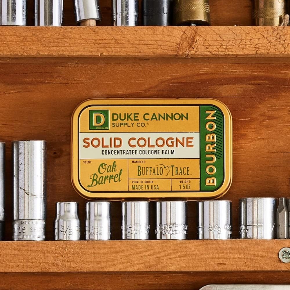 Duke Cannon Bourbon solid cologne tin open reveals balm texture.