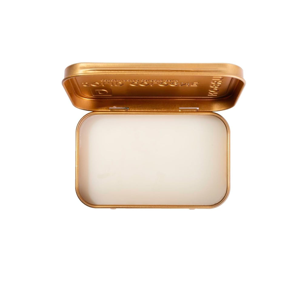 Duke Cannon Bourbon solid cologne woodsy application demonstrates precise dab.