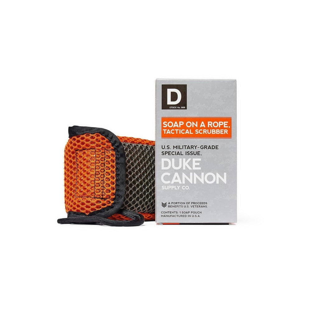Duke Cannon Tactical Scrubber Pouch with coarse mesh for thorough scrubbing in a rugged shower.
