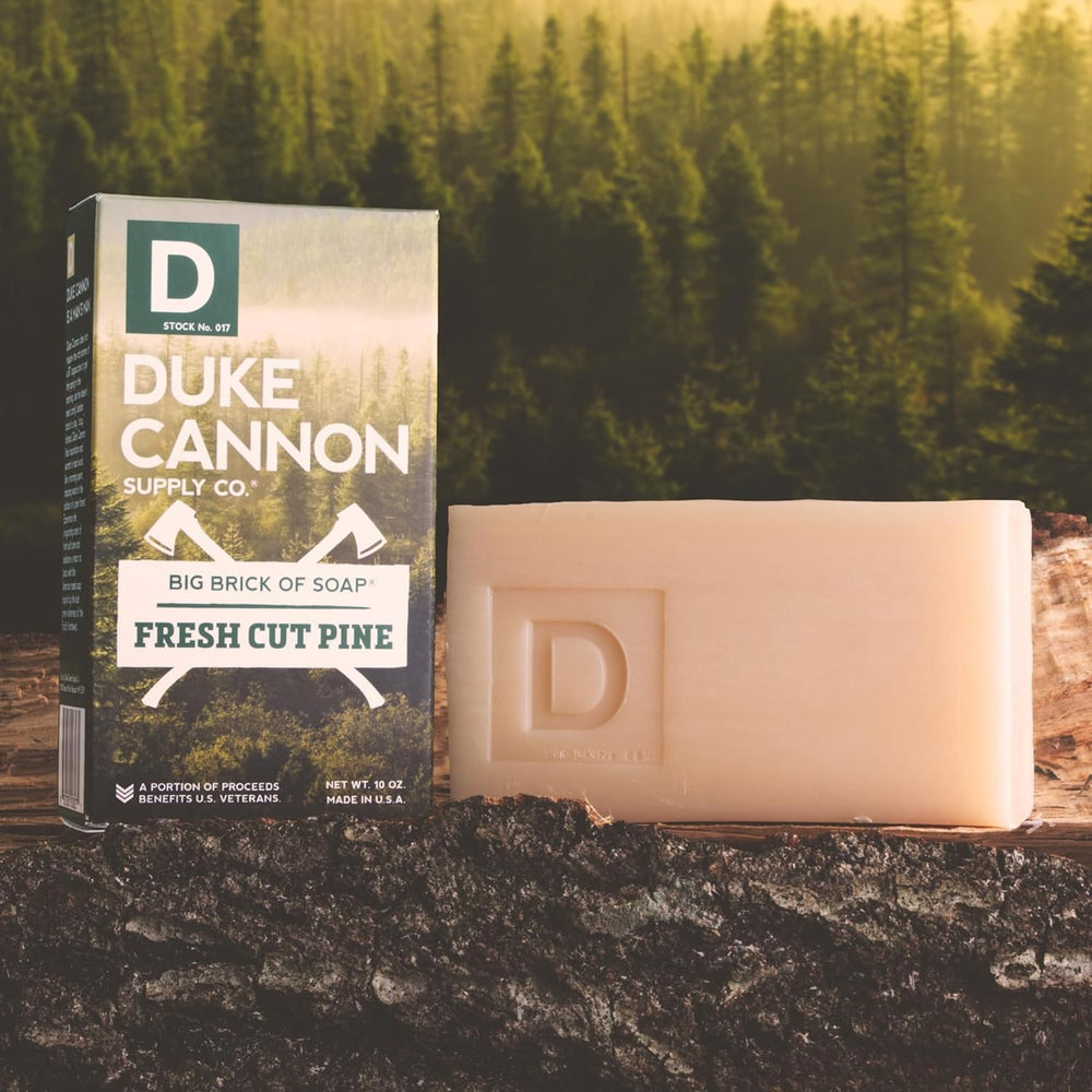 Duke Cannon soap bubbles on rustic surface signal fresh cleansing experience.