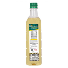 Dwaraka castor oil label close-up emphasizing organic cold-pressed quality.