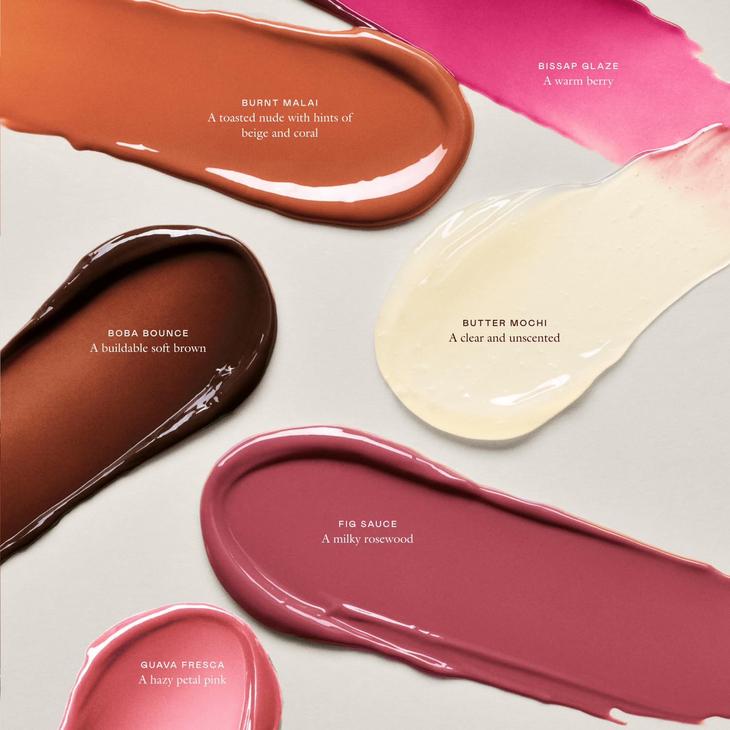 EADEM Le Chouchou gloss shot emphasizes bold Bissap Glaze shade and shine.