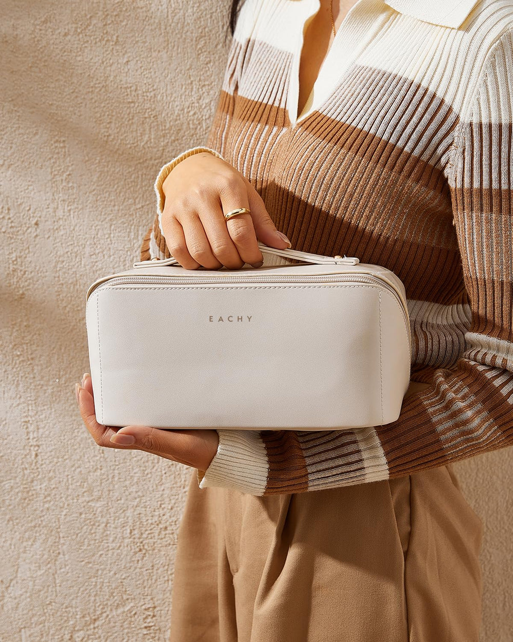 EACHY waterproof makeup bag is easy to clean after flights and hotel stays.