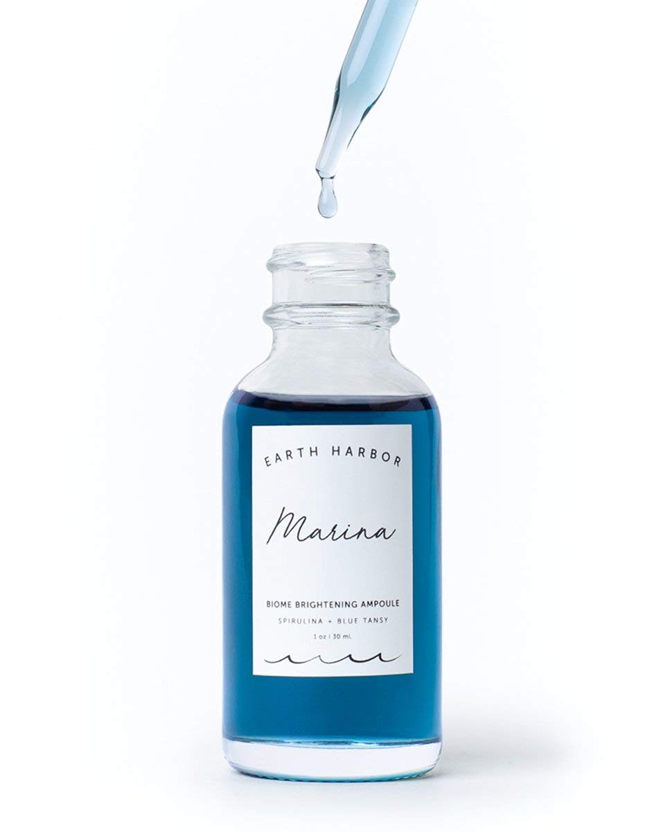 Earth Harbor Marina bottle on vanity suggests daily-use for even-toned, luminous skin.