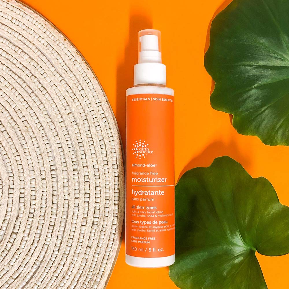 Earth Science fragrance-free almond-aloe moisturizer hand care close-up demonstrating smooth, non-oily absorption.