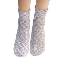 Earth Therapeutics Aloe Socks with lotion application for enhanced hydration.