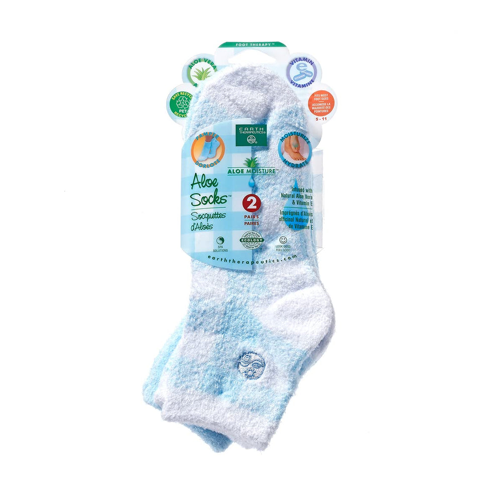 Earth Therapeutics Aloe Socks worn on foot show overnight hydration potential.