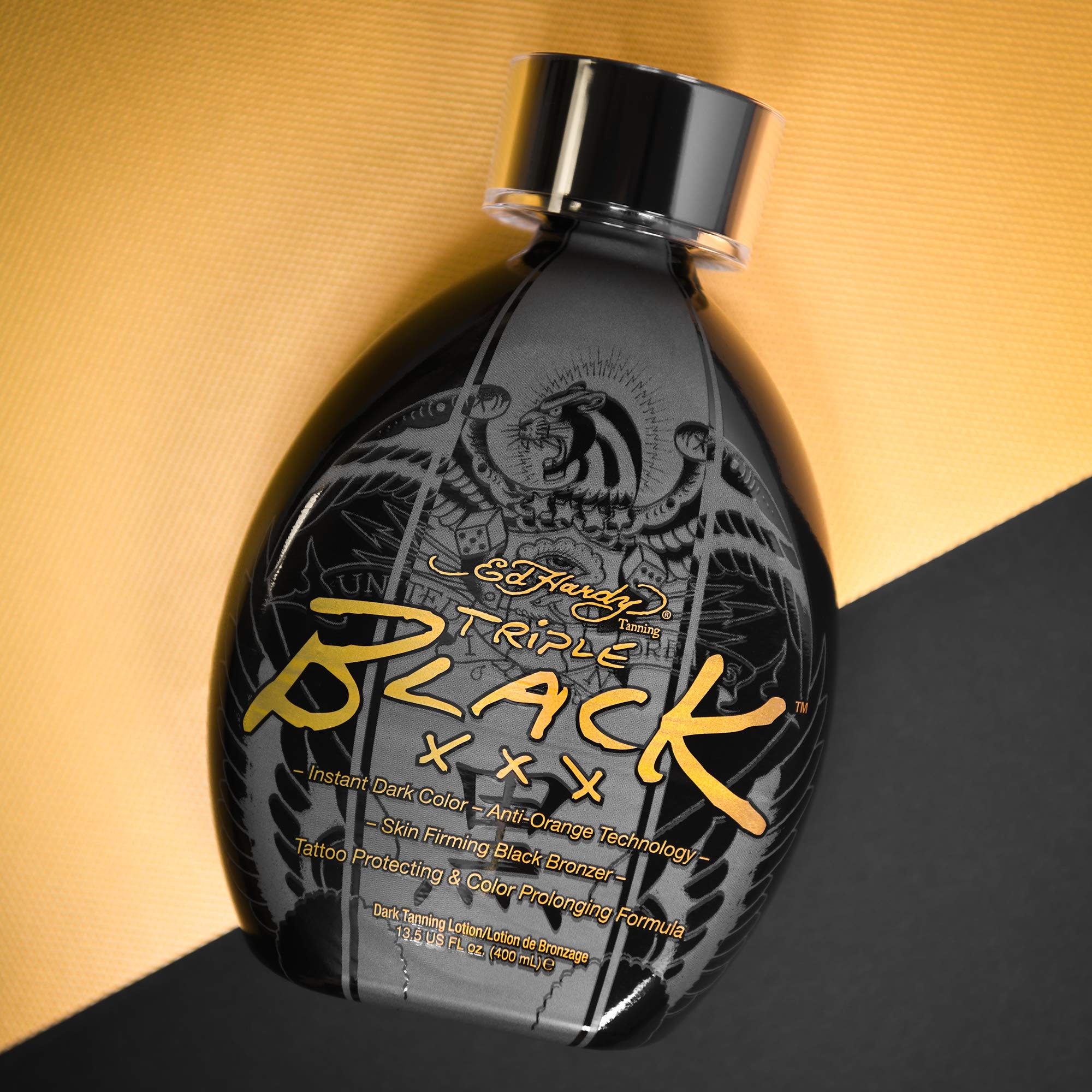 ED HARDY Black XXX lotion swirl on skin indicating rich color and hydration