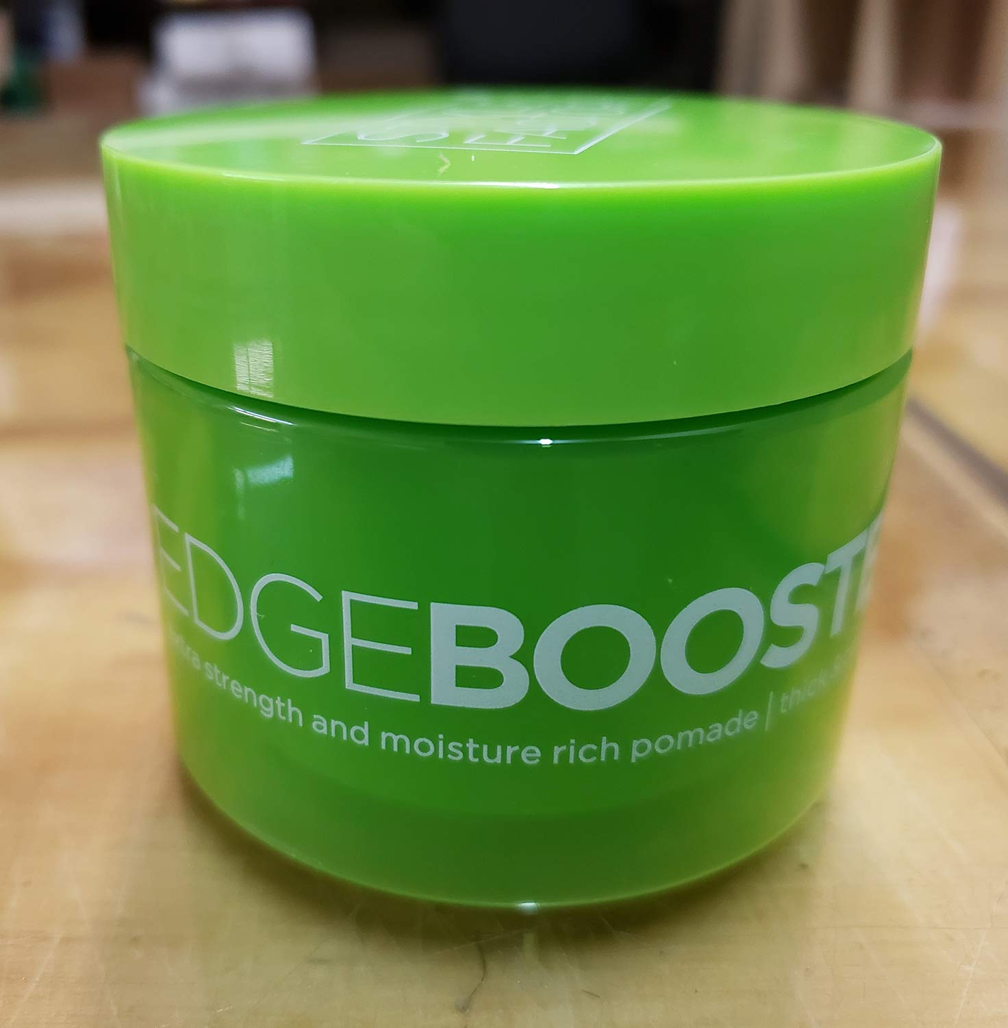 Emerald jar close-up from Edge Booster shows easy application.