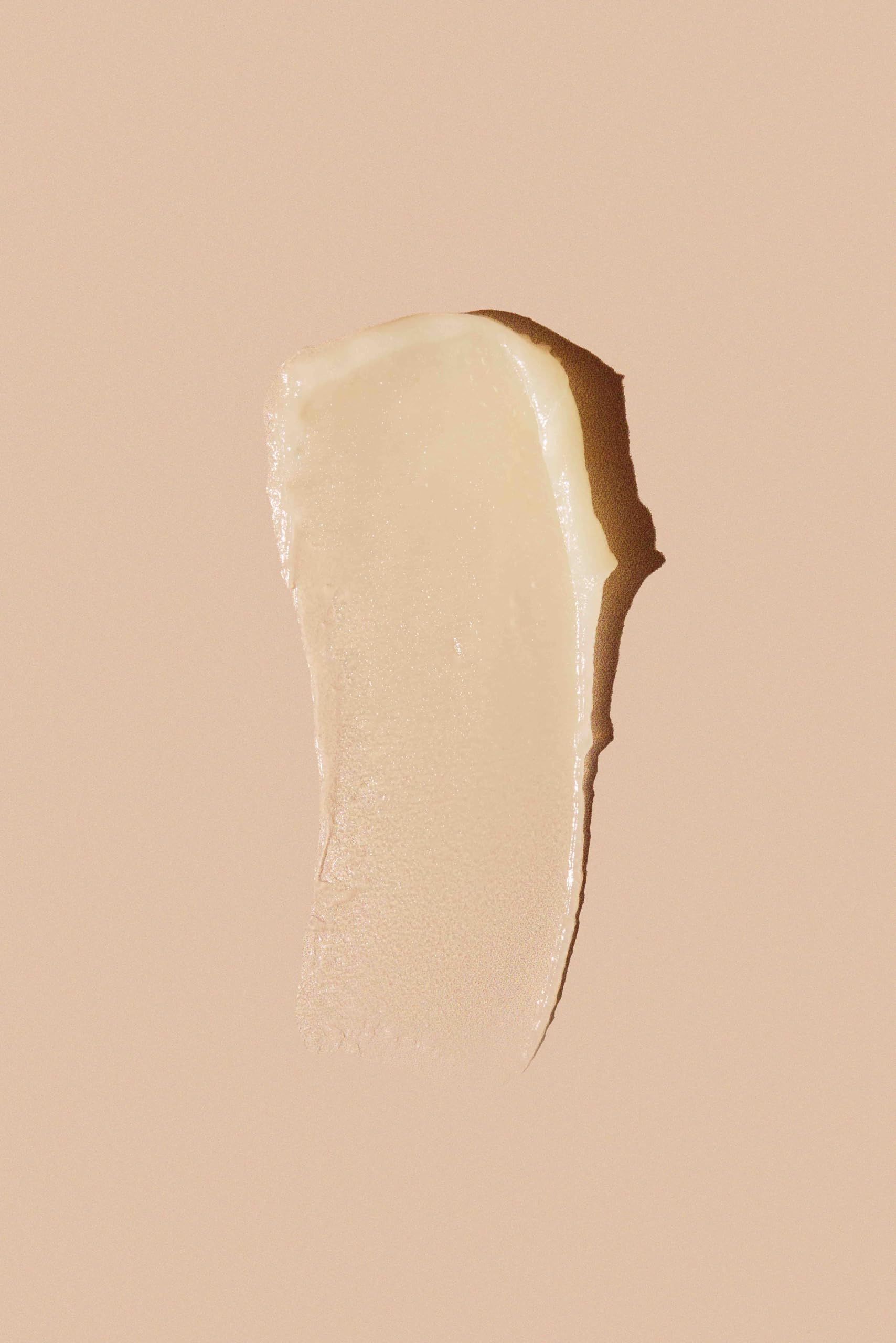 Egyptian Magic hair treatment application for frizz control and shine
