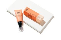 Close-up of applying Eight Saints hand cream on dry skin for moisture