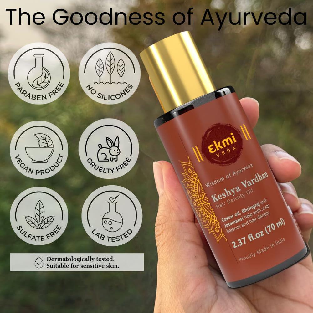 Pouring texture of EKMIVEDA oil showing silky consistency for massage