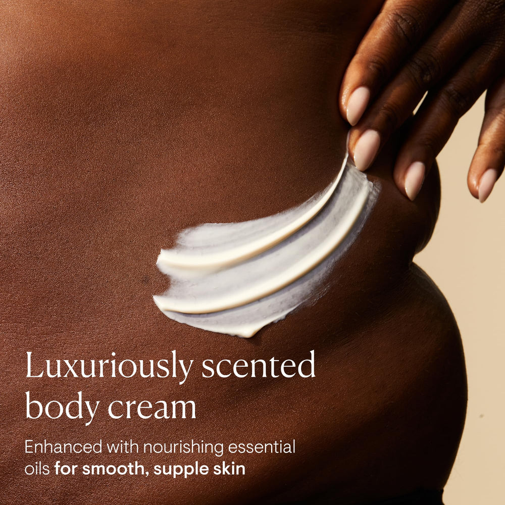 Close-up of ELEMIS Frangipani Monoi cream texture for smooth application.
