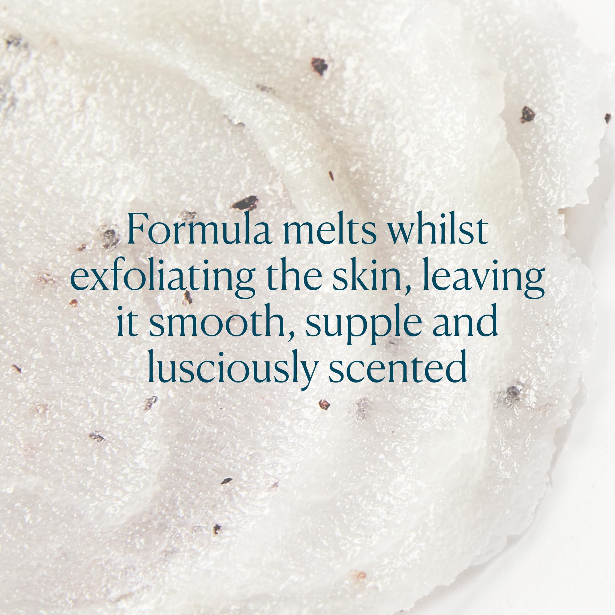 Golden oil swirls in ELEMIS Frangipani Monoi Salt Glow indicate hydrating formula.