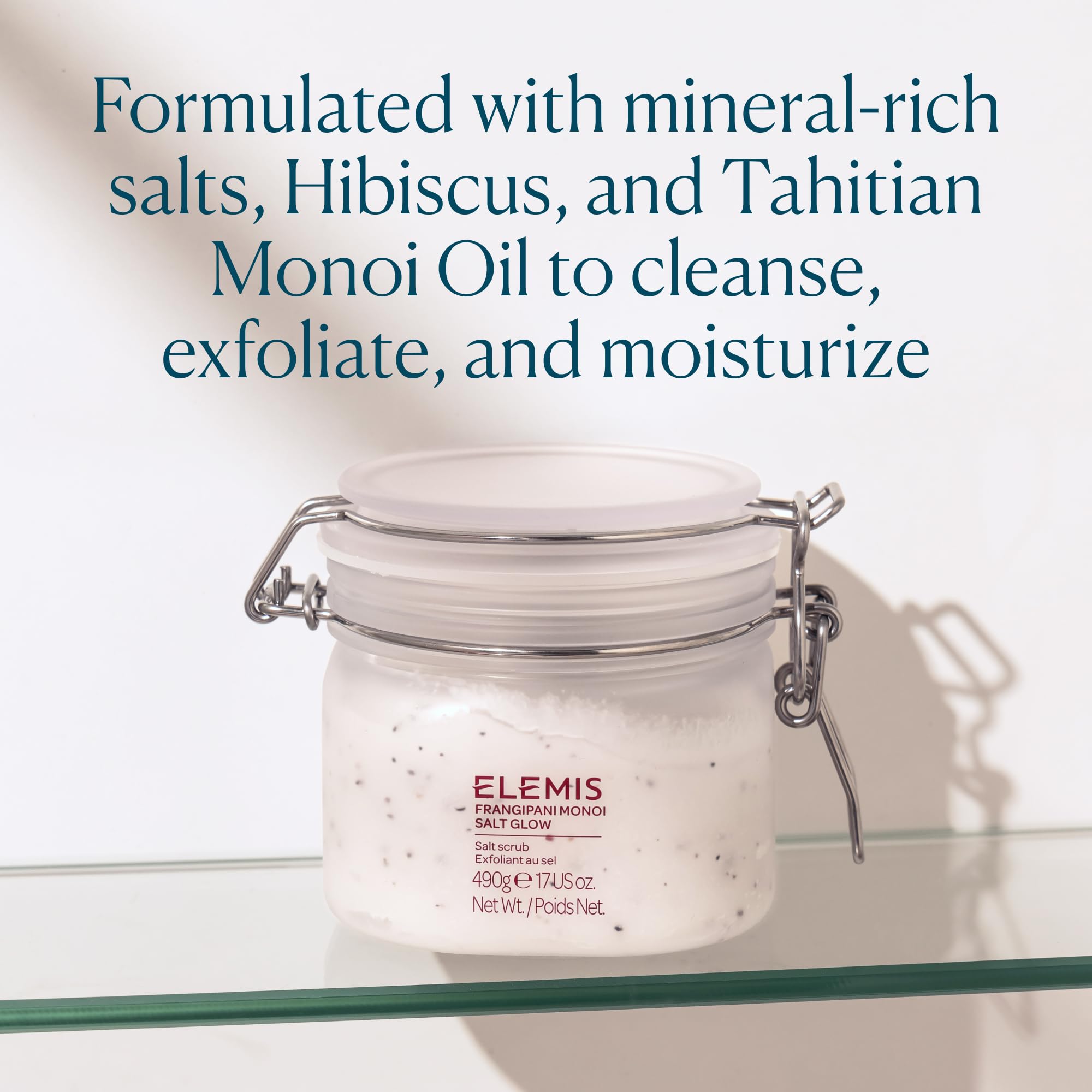 Back view of ELEMIS Salt Glow jar—ingredient list and moisture sealing properties.