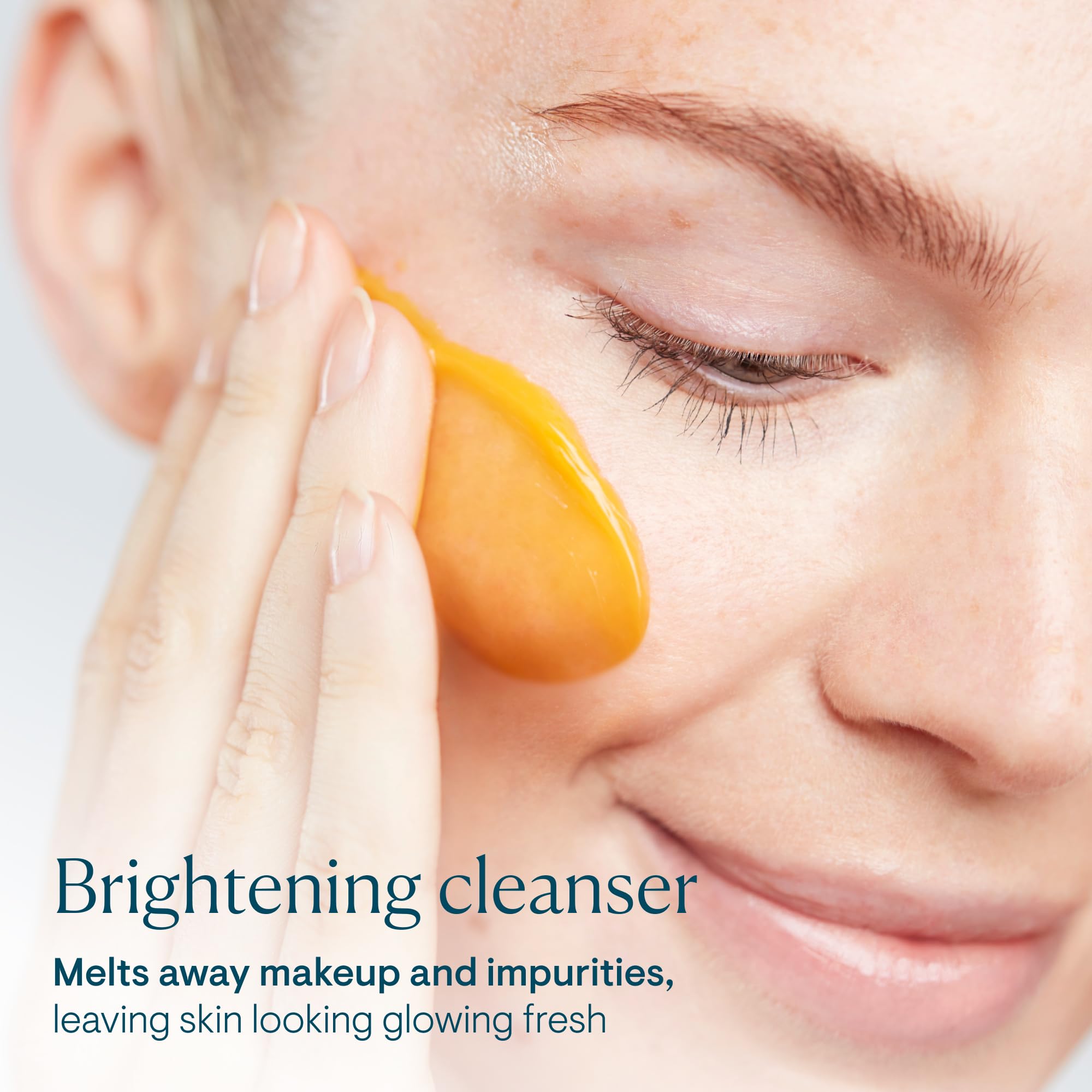 ELEMIS cleanser application showing butter-to-milk transformation on dry skin.