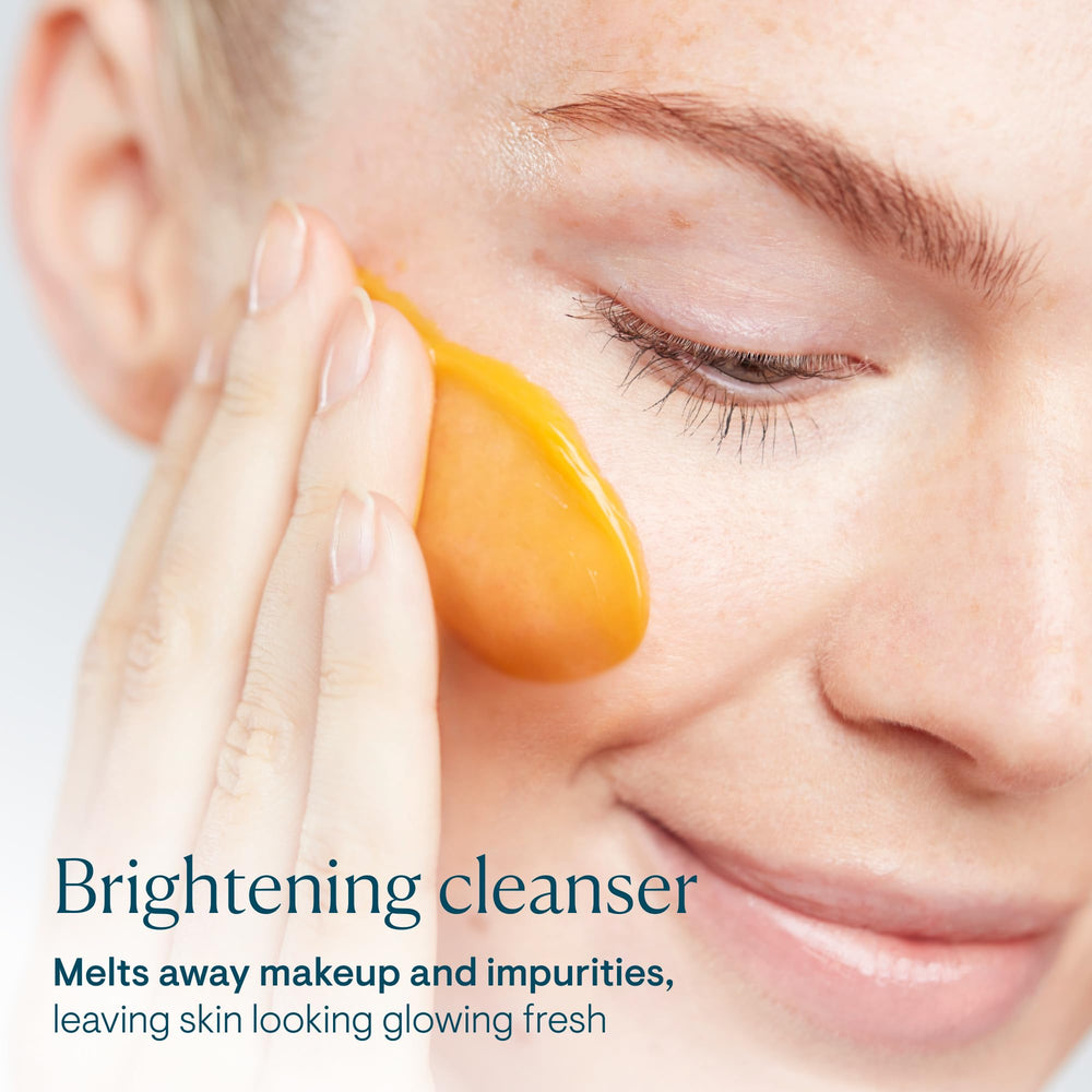 ELEMIS cleanser application showing butter-to-milk transformation on dry skin.