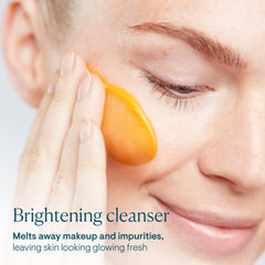 ELEMIS cleanser application showing butter-to-milk transformation on dry skin.