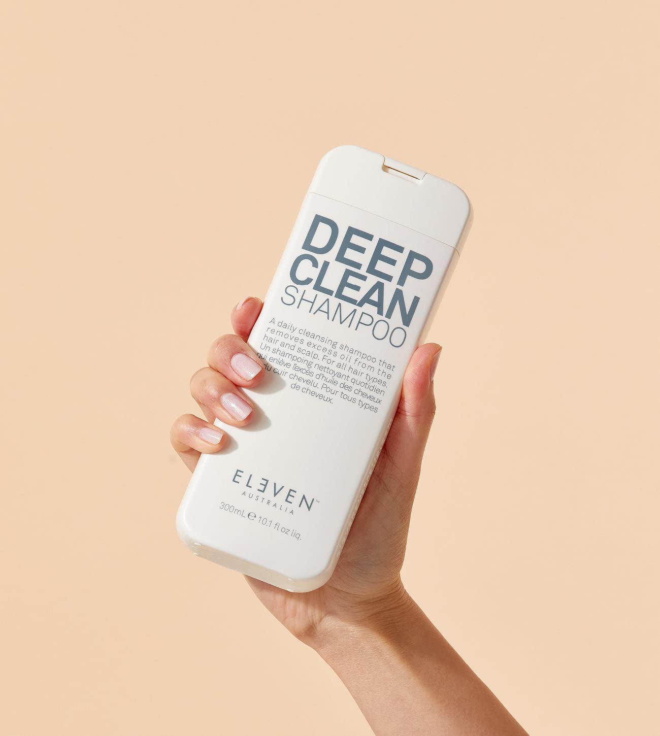 ELEVEN AUSTRALIA Deep Clean Shampoo orange-oil close-up signals citrus cleansing aroma and vitality.