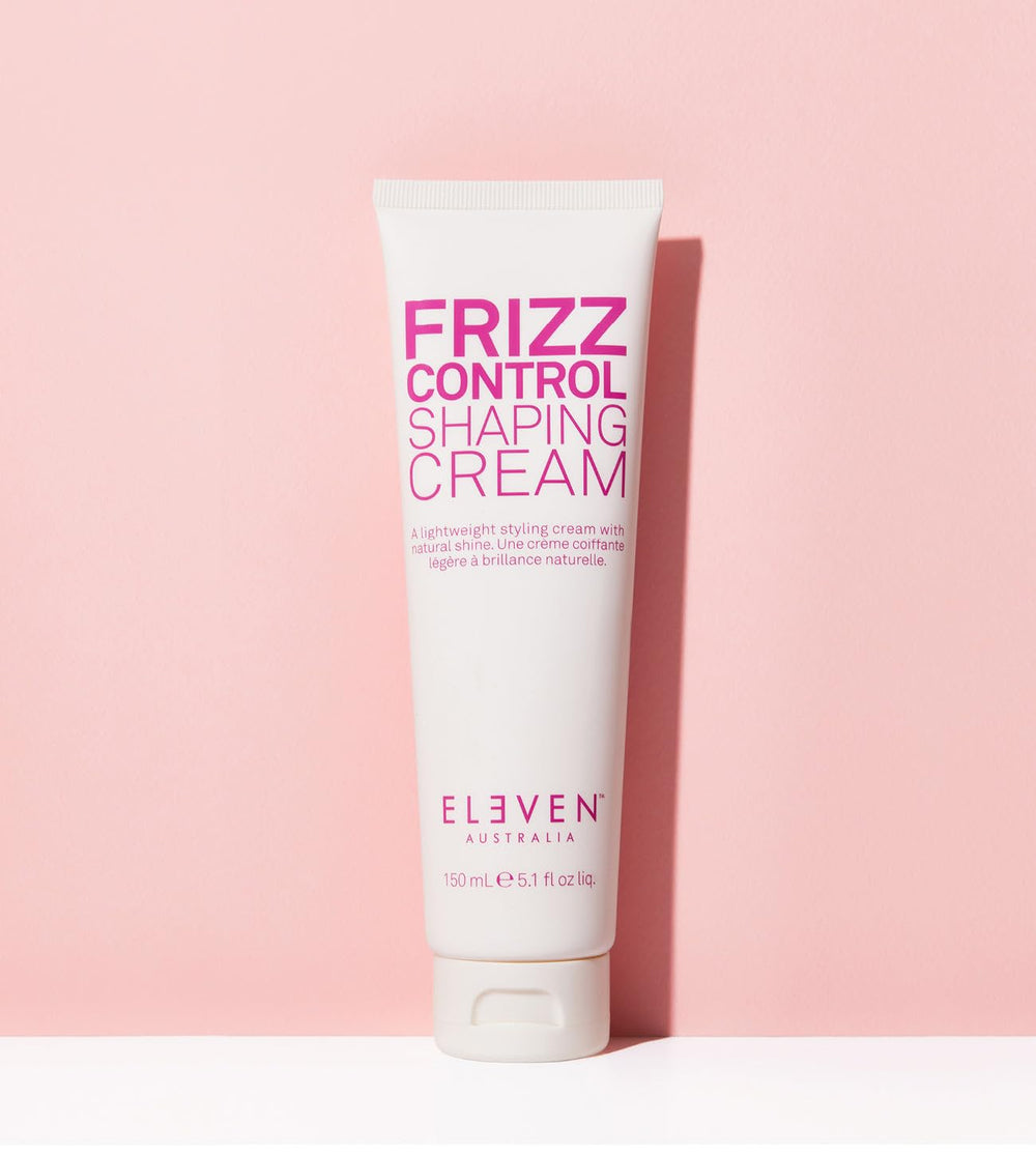 ELEVEN AUSTRALIA Frizz Control Shaping Cream application-hands shows creamy texture and even distribution.