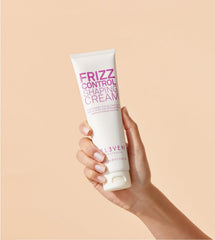 ELEVEN AUSTRALIA Frizz Control Shaping Cream pump-dispense demonstrates precise application for flyaway control.