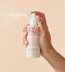 ELEVEN AUSTRALIA Miracle Leave-In Spray application pump shows easy detangling and smoothing.