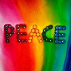 Elfinbay tablet dissolving in water releasing vibrant colors for creative bath play.