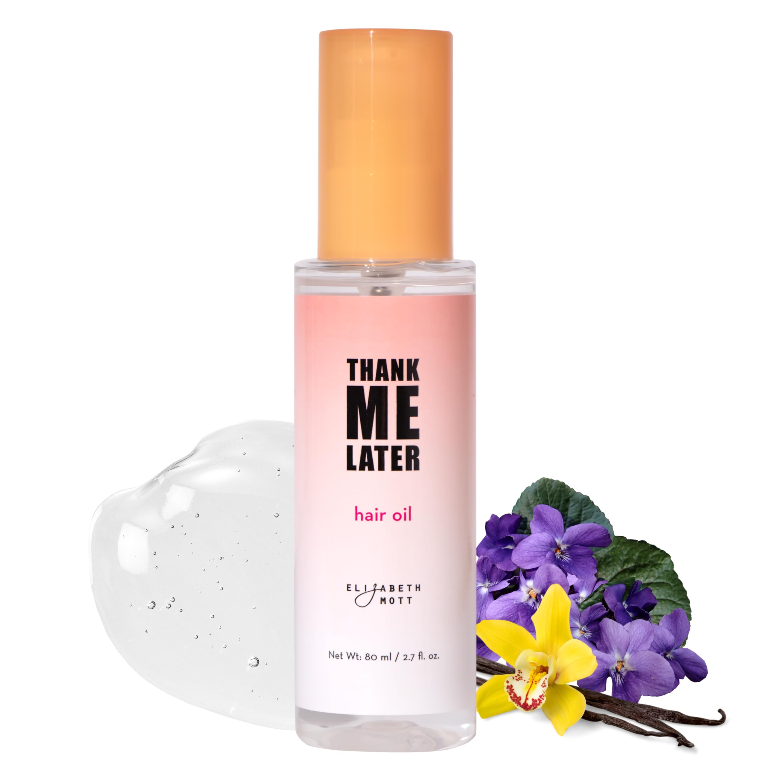 Elizabeth Mott hair oil bottle closeup showing nourishing frizz-control formula.