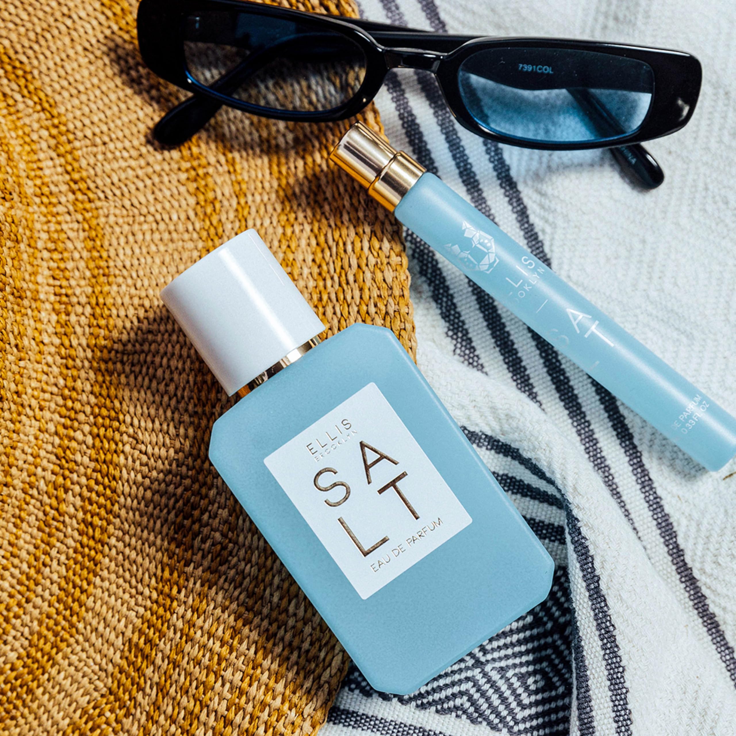 Ellis Brooklyn Salt EDP amber hue bottle, evokes sun-drenched warmth and tropical vibes.