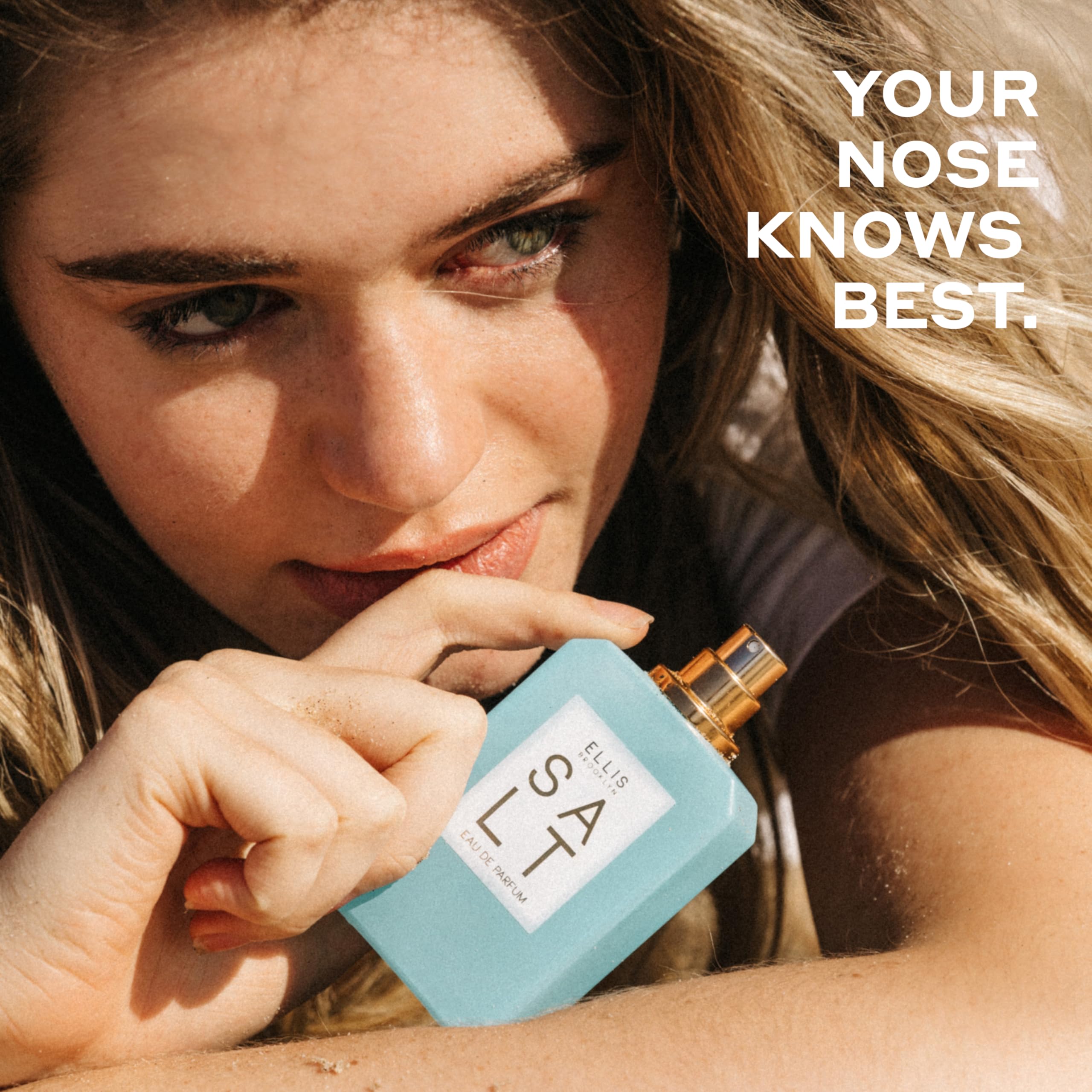Ellis Brooklyn Salt travel spray on warm sand communicates portable tropical scent.