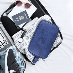 Elviros toiletry bag PU leather closeup highlights premium water-resistant material for damp environments.