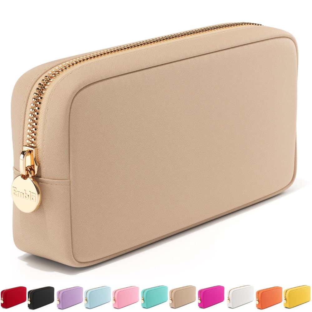 Embla makeup bag sand front view shows compact travel storage for cosmetics.